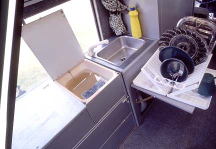 Land Rover Dormobile washing dishes