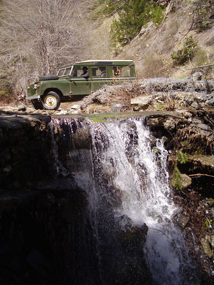 Series Land Rover 109 at waterfall