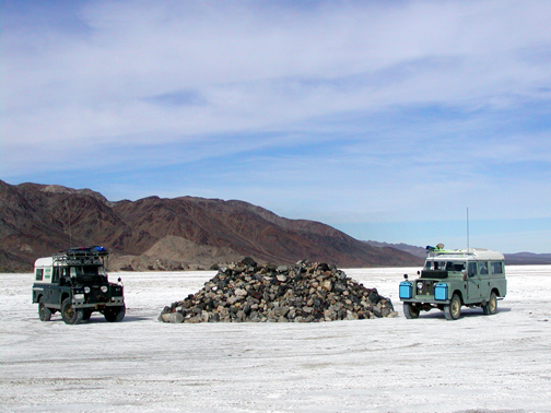 2 Land Rover Dormobiles at Mojave trail rock pile